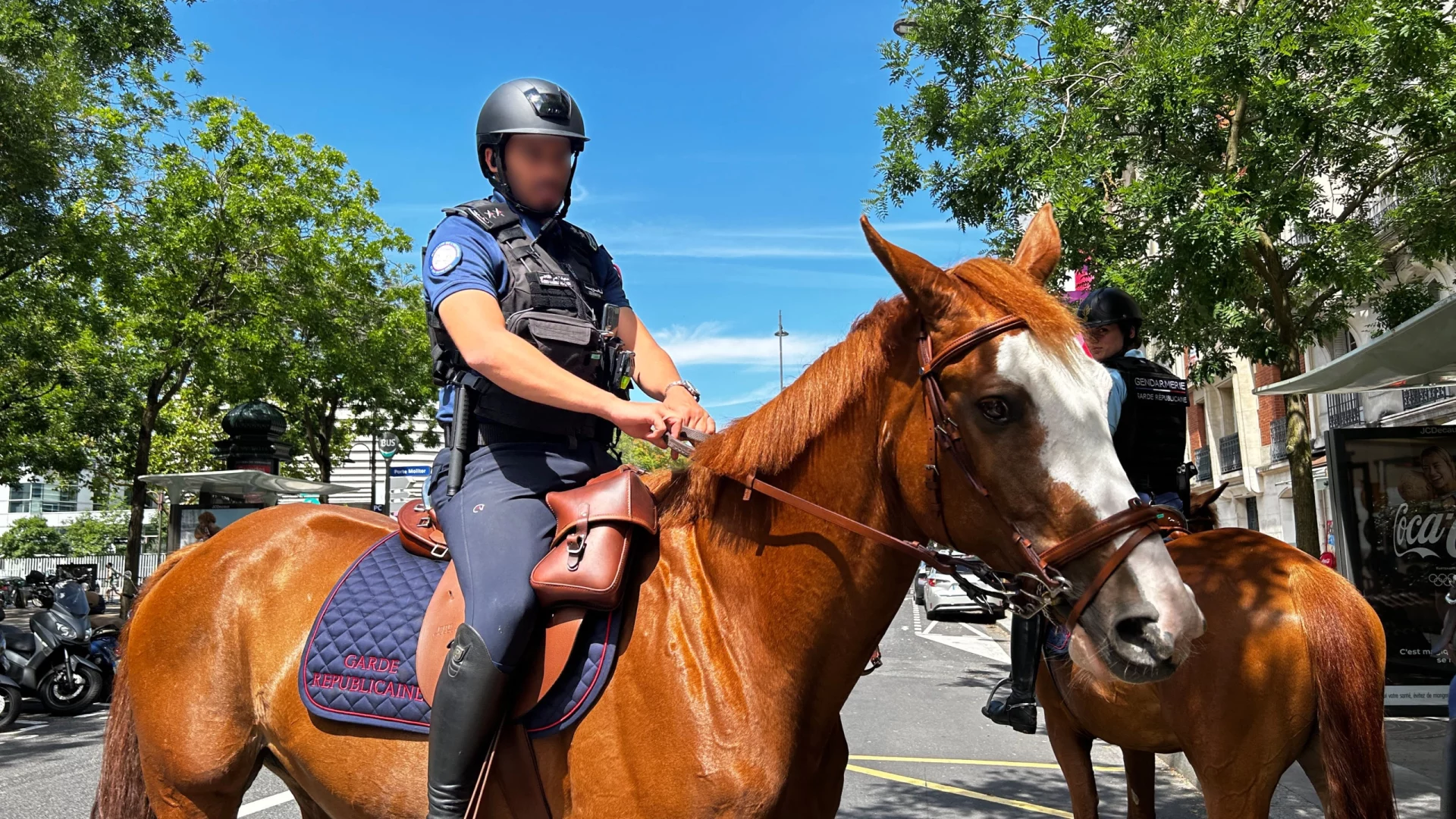 Mounted police patrol securing central Paris during the Paris 2024 Games