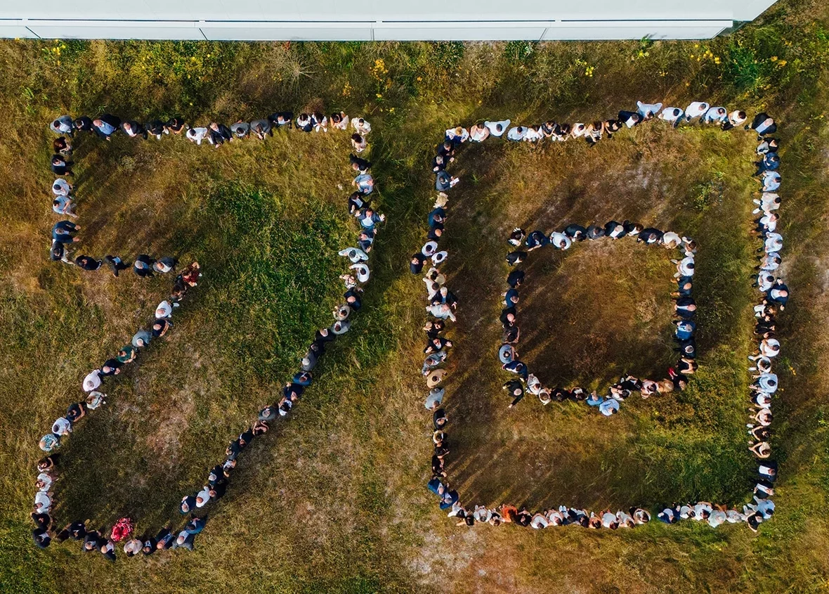 Employees forming the number 70 during the inauguration of Conextivity Group’s new production site in Amarante