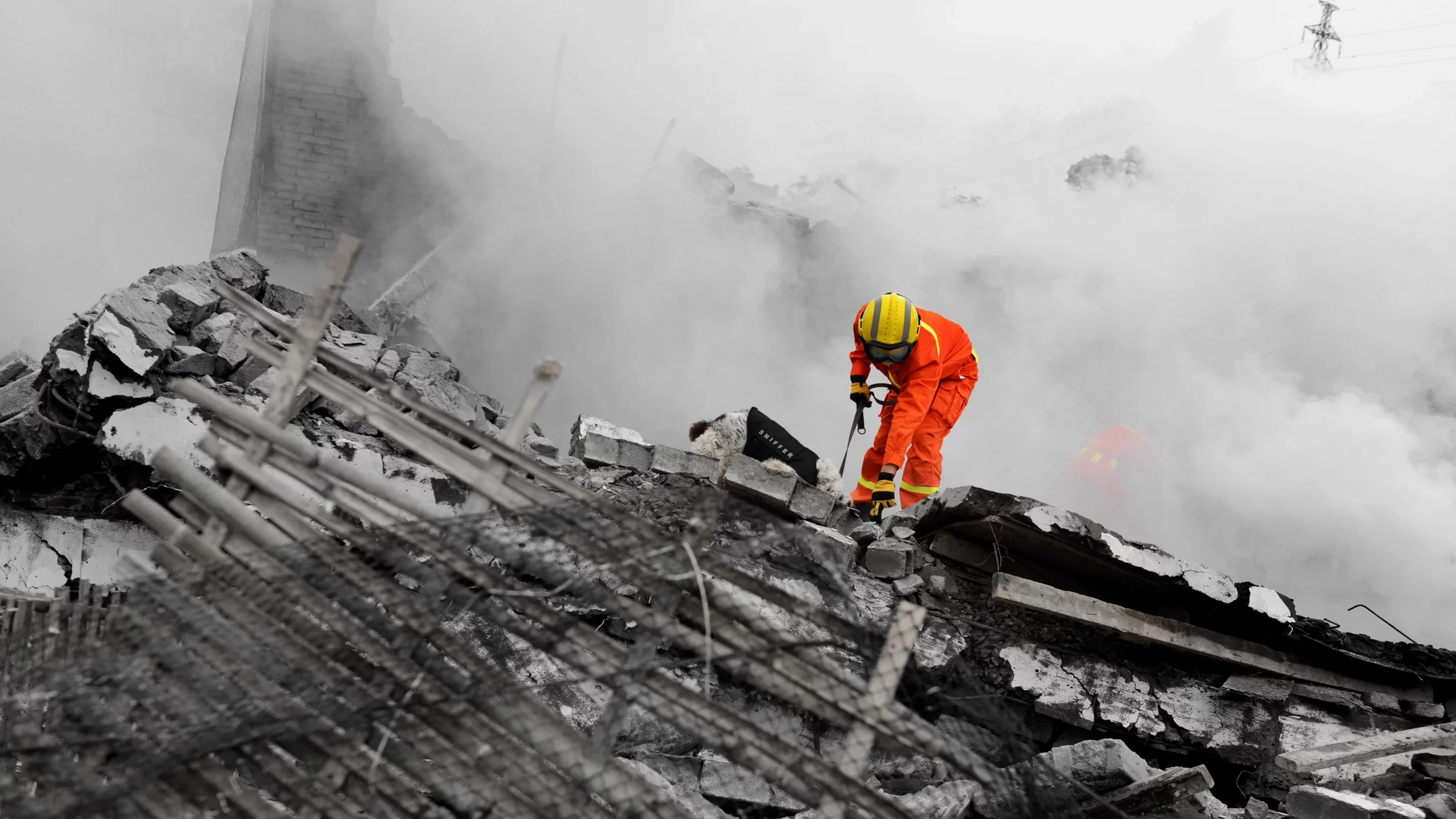 Rescue worker operating on unstable terrain after a structural collapse