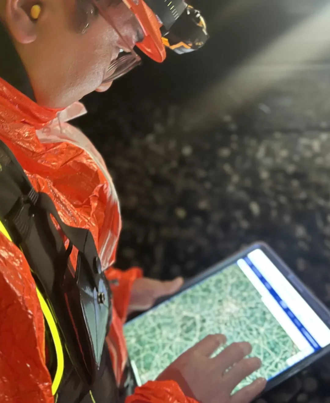 Supervisor monitoring field operations on a tablet to ensure team safety