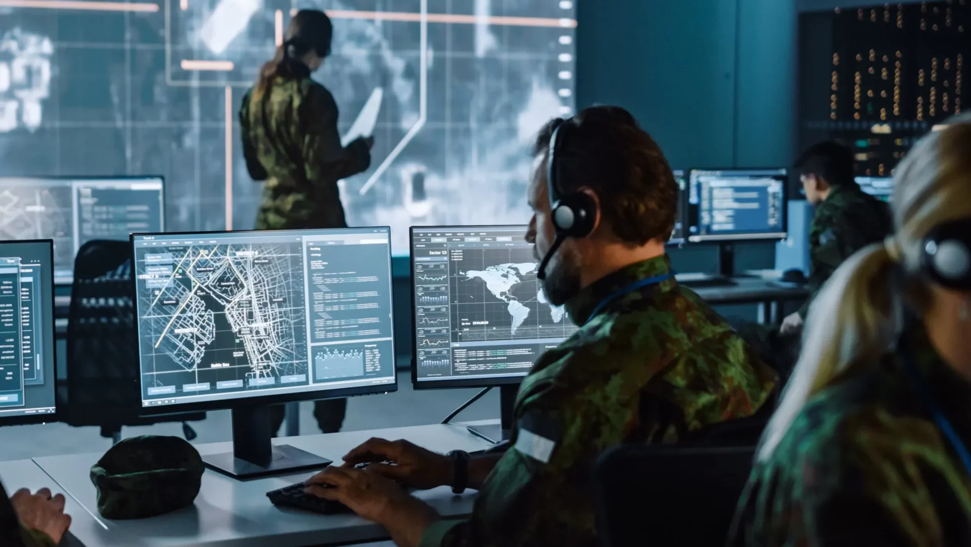 Command staff monitoring real-time operational data in a control room